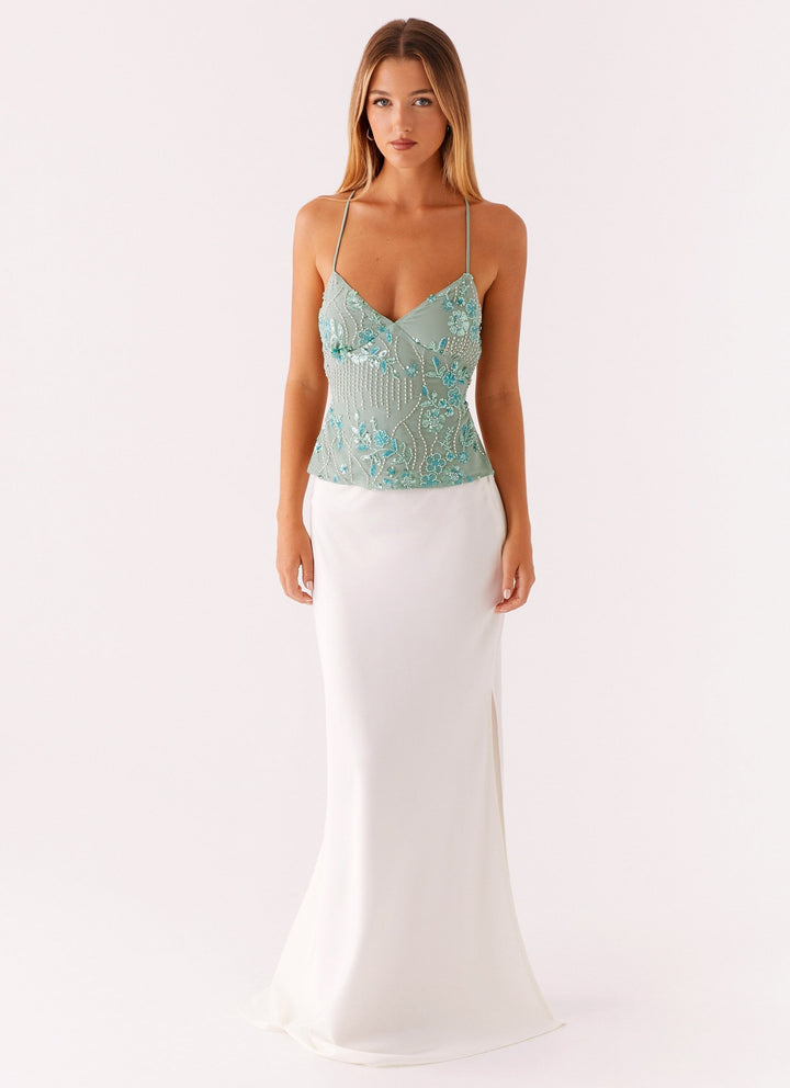 Festtop med perler og spaghettistropper